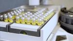 Clear glass chemical bottles containing Lnear alkylbenzene (LAB) made from renewable carbon