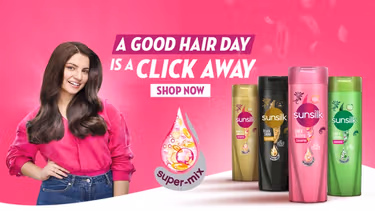 Four Sunsilk products next to a happy woman and a text that reads "A good hair day is a click away"