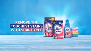 Three Surf Excel products, a pile of clean folded laundry, and a text that reads "Remove the toughest stains with Surf Excel".