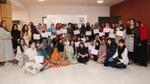 Group of girls holding a certificate.