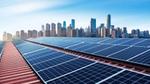 Solar panels on a building roof, with a view of a Chinese city skyline in the distance.