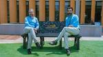 Amir Paracha along with Babar Aziz Bhatti,Director,Green Earth Recycling sitting on a bench made out of recycled plastic